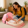 couffin bébé rose travelbaby dans le salon